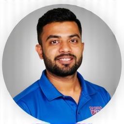 Headshot of Fielding & Fitness Coach Anil Kumar
